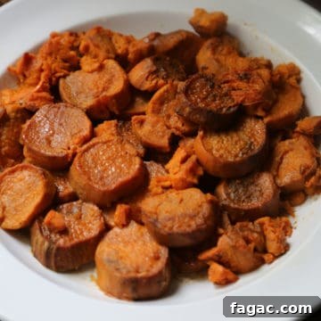 sliced candied sweet potato in a white bowl