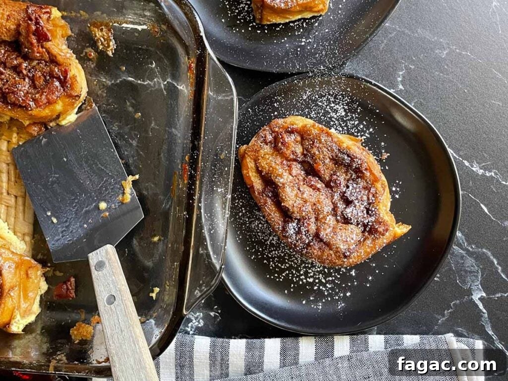 Sausage and Hashbrown Breakfast Casserole for 12 Guests 18 Slices of overnight maple bacon baked french toast on black plates garnished with powdered sugar.