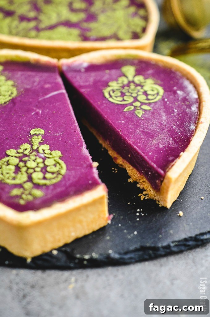 Stunning stencilled Purple Sweet Potato Cheesecake Tart is a light, creamy, easy addition to your holiday dessert line-up. I Sugar Coat It
