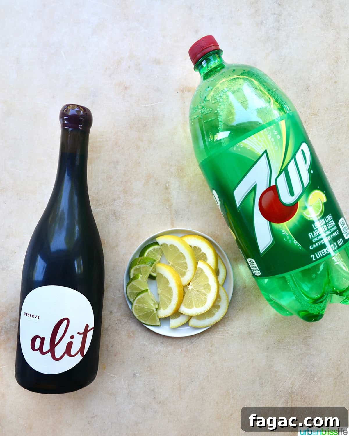 Authentic Tinto de Verano Recipe: Refreshing Spanish Wine Cooler 4 bottle of red wine, bottle of lemon lime soda, plate with lemon and lime slices.