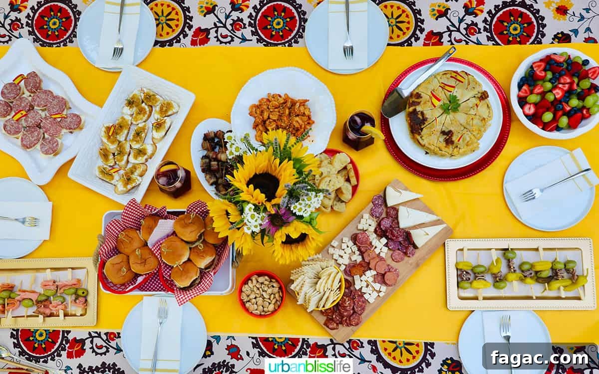 Authentic Tinto de Verano Recipe: Refreshing Spanish Wine Cooler 9 colorful table setting with several plates of Spanish tapas and pintxos, glasses of tinto de verano.
