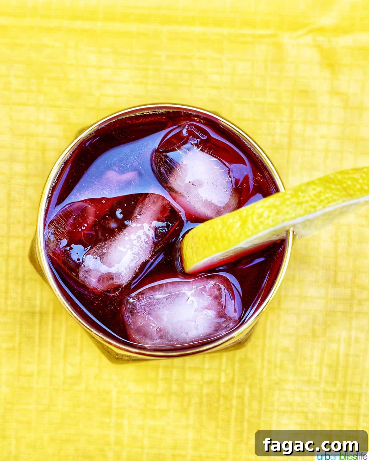 Authentic Tinto de Verano Recipe: Refreshing Spanish Wine Cooler 10 overhead of glass of tinto de verano wine cocktail with lemon slice.
