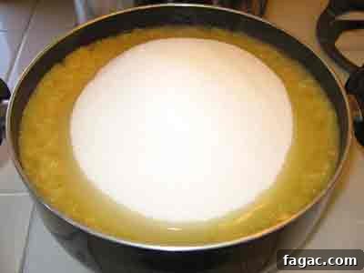 Quince Spoon Sweet Recipe (Kydoni Glyko) — Traditional Cypriot Preserve 5 Adding sugar to quince in greek spoon sweet recipe kidoni gliko.