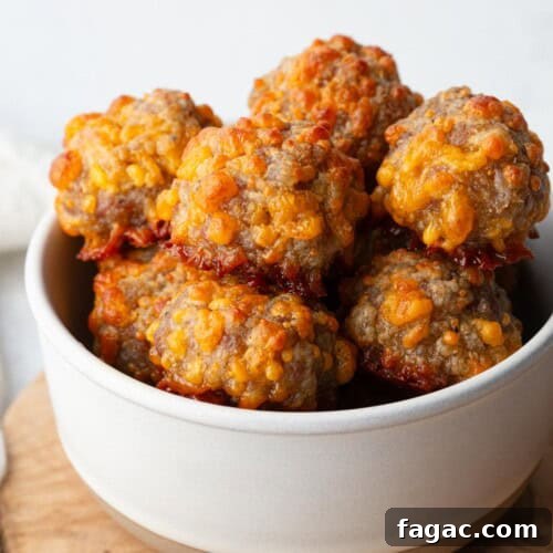cheesy sausage balls in a white bowl.