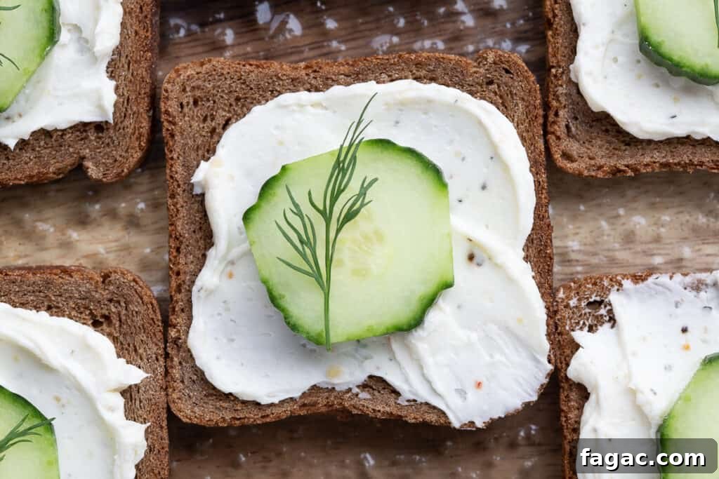 Mini Cucumber Sandwiches: Light Tea Sandwich Recipe 9 single mini cucumber open faced sandwich topped with a dill sprig.