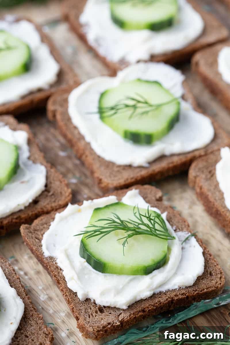 Mini Cucumber Sandwiches: Light Tea Sandwich Recipe 10 mini pumpernickel bread topped with cream cheese and a cucumber slice, topped with a sprig of fresh dill.