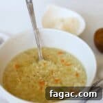 Pastina Soup in white bowl.