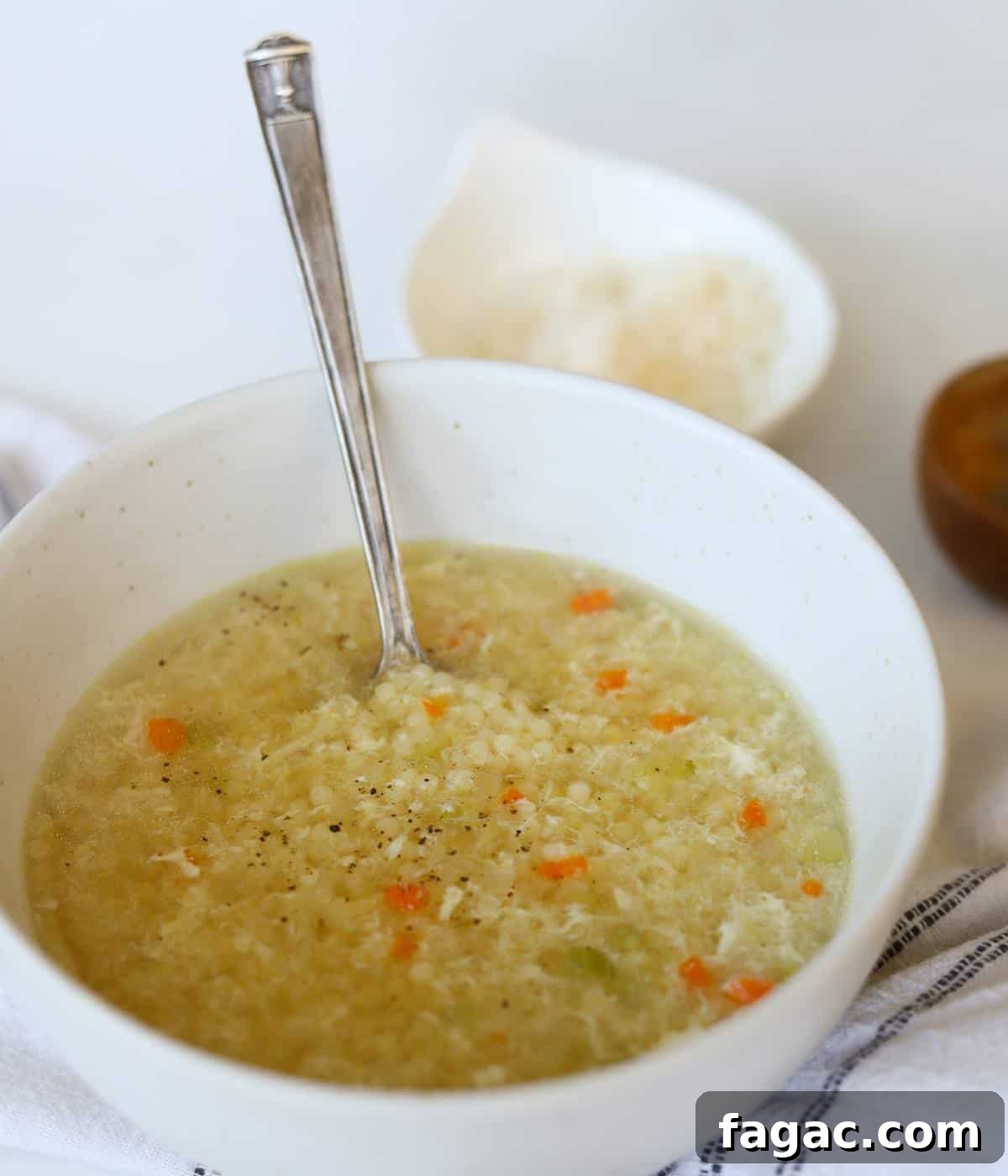 Pastina Soup in white bowl.