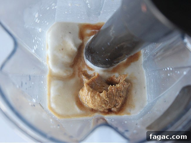 Peanut Butter Chocolate Chip Nice Cream Recipe for Creamy Frozen Dessert 7 Blending bananas and peanut butter in a blender.