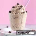Peanut Butter Chocolate Chip Nice Cream Recipe for Creamy Frozen Dessert 10 Glass cup full of ice cream with chocolate chips.