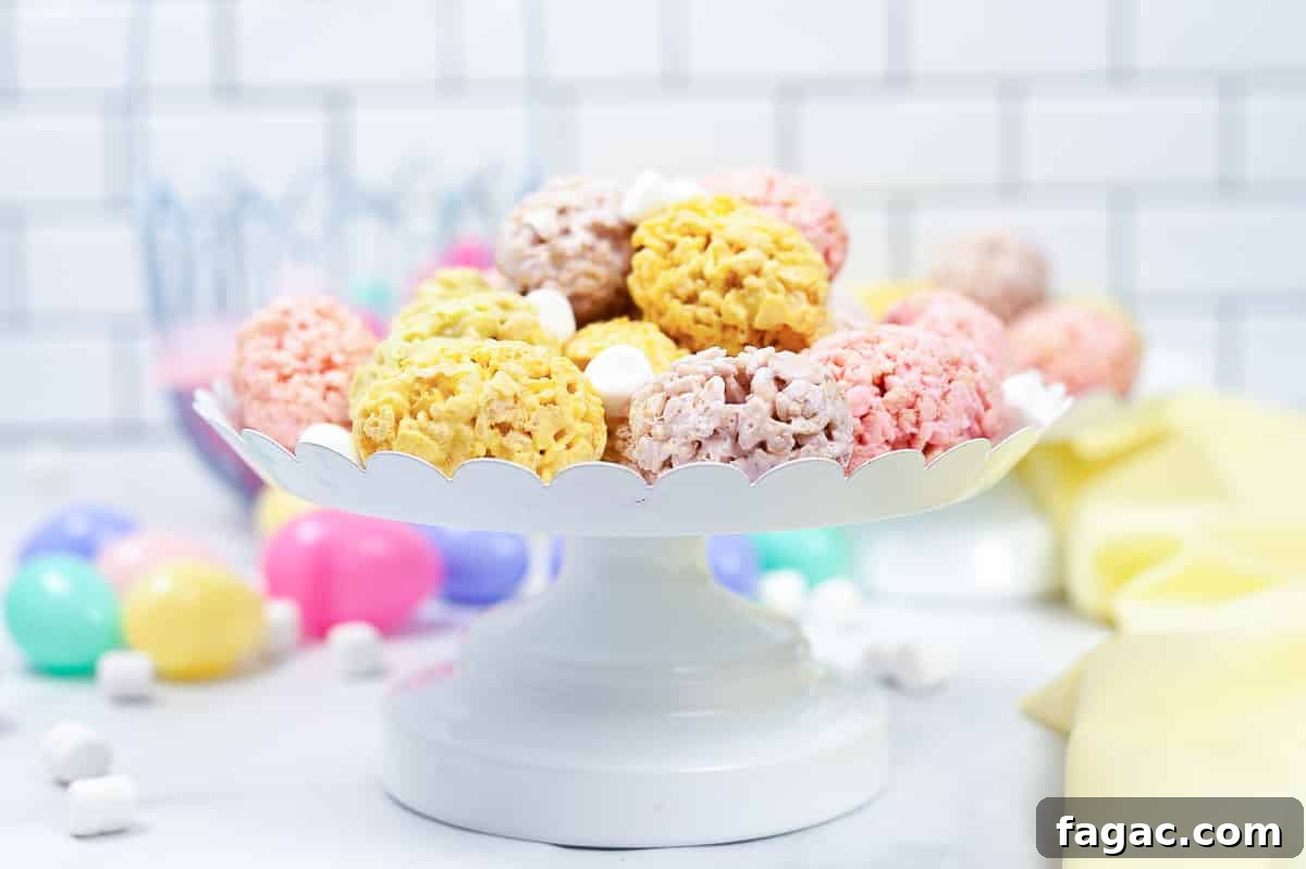 Easter Rice Krispie Treats: Festive Bunny and Egg Recipes 4 side view of white serving tray full of easter rice krispie treats sprinkled with white mini marshmallows