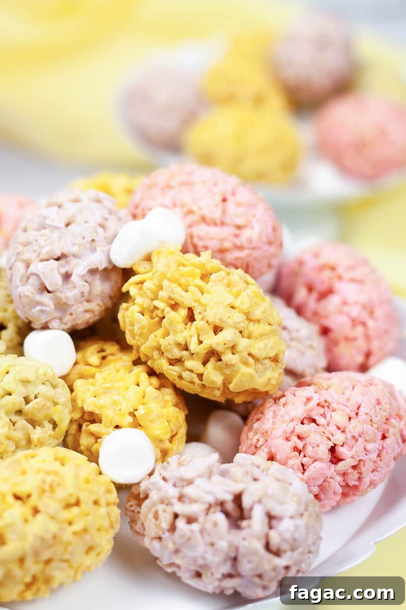 Easter Rice Krispie Treats: Festive Bunny and Egg Recipes 5 close up of easter rice krispie treats on white serving tray sprinkled with white mini marshmallows