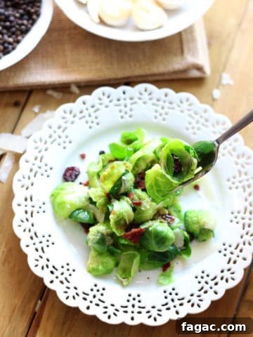 Brussel-Sprouts-Salad White laced place containing Brussels Sprout Salad