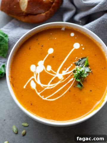 Overhead view of tomato soup in a bowl.