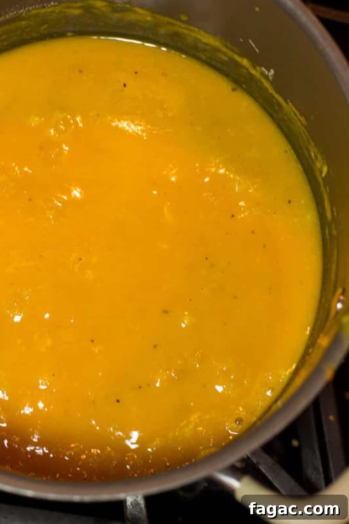 Creamy Hubbard Squash Soup Recipe for Fall Comfort 10 Pot of hubbard squash soup cooking on stove top.