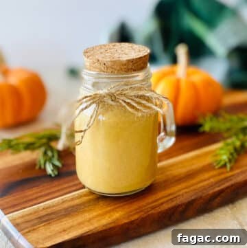 starbucks pumpkin sauce recipe in a mason jar with twine and a cork.