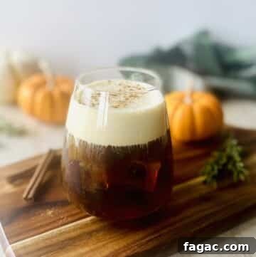 starbucks pumpkin cream cold brew coffee with pumpkins in background.