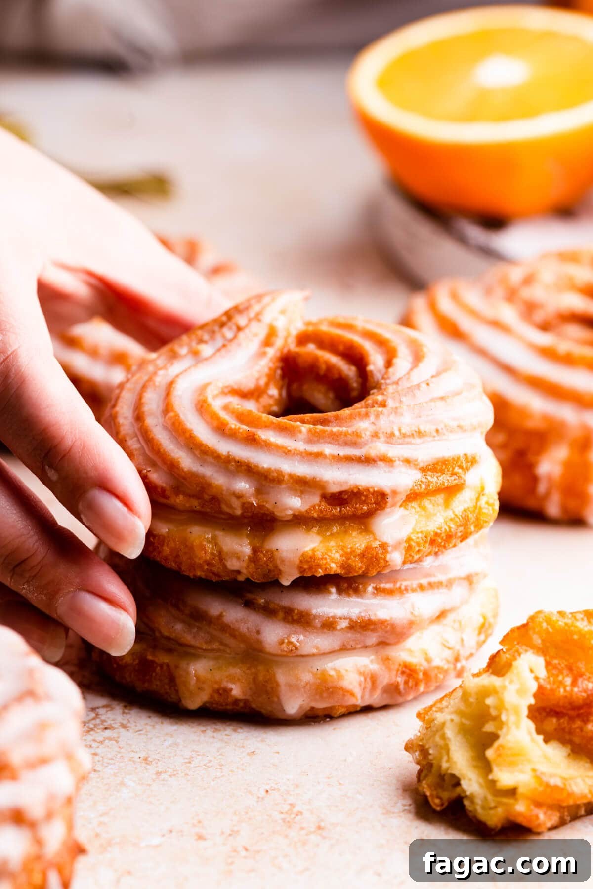 Classic French Cruller Donuts: Light, Crispy Pastry Recipe 7 super close up side view at two french cruller doughnuts stacked on top of each other