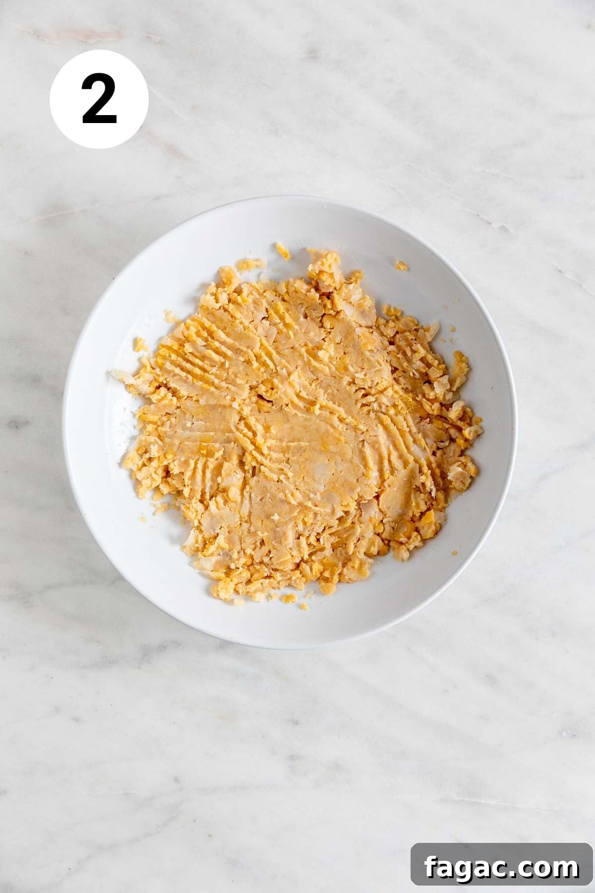 Vegan Tuna Recipe: Plant-Based Tuna Alternative Guide 5 Mashed chickpeas in a shallow dish.