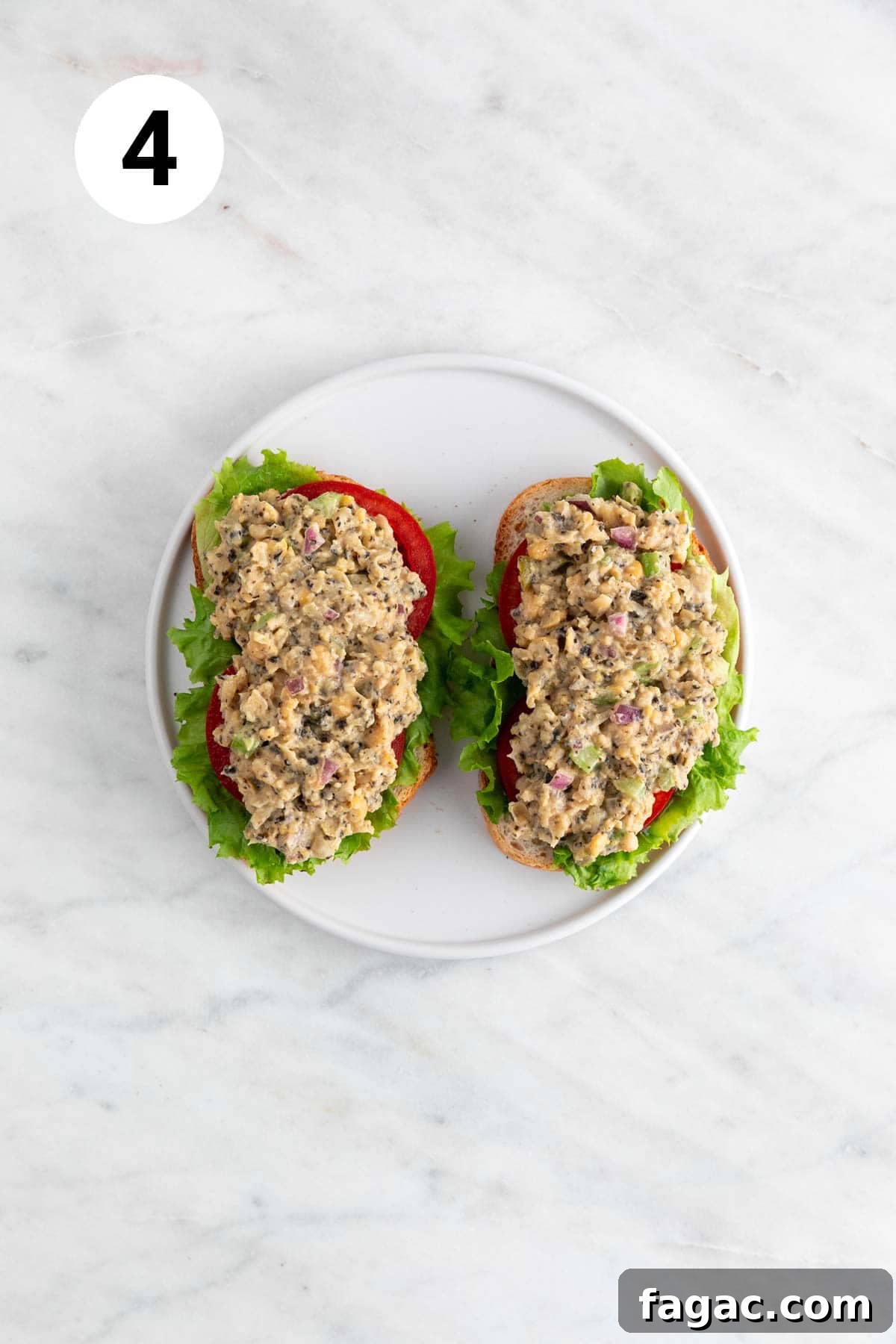 Vegan Tuna Recipe: Plant-Based Tuna Alternative Guide 7 Vegan tuna on 2 slices of bread, with lettuce and tomato.