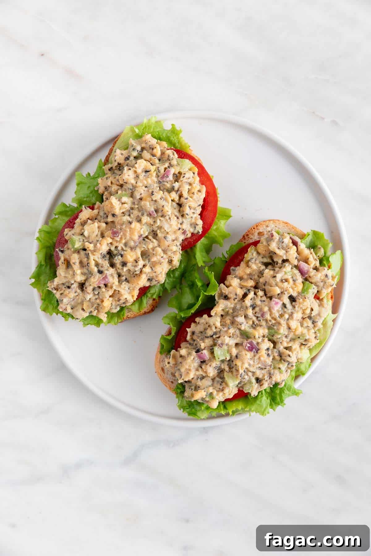Vegan Tuna Recipe: Plant-Based Tuna Alternative Guide 8 Two slices of bread with vegan tuna, lettuce, and tomato slices.