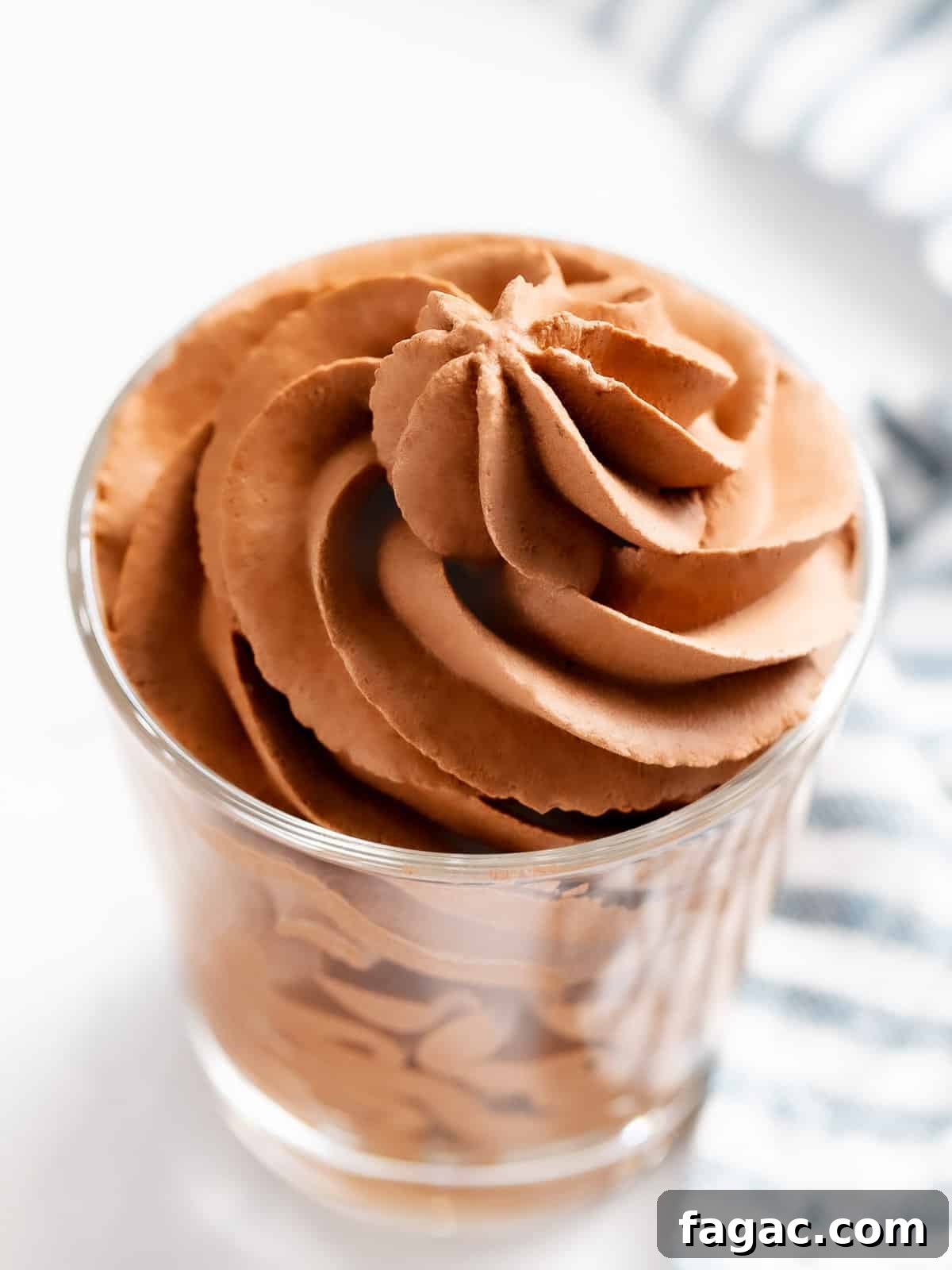 Chocolate whipped cream in a glass cup.