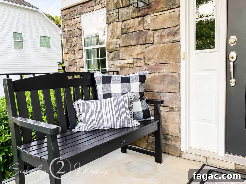close up of bench with pillows on side of small front porch