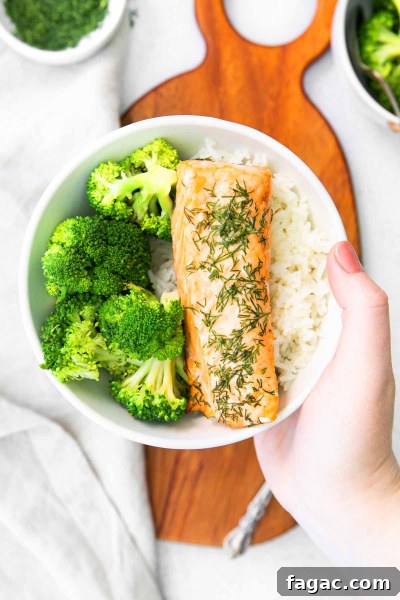 Crispy Air Fryer Salmon with Fresh Dill Recipe 7 bowl with filet of air fryer salmon and broccoli and rice