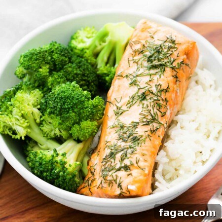 Crispy Air Fryer Salmon with Fresh Dill Recipe 8 close-up of a bowl with filet of air fryer salmon and broccoli and rice