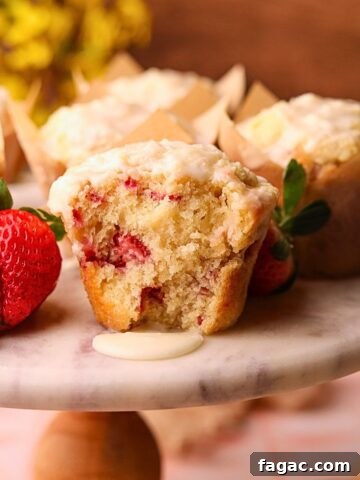 Strawberry short cake muffins on a cake platter.