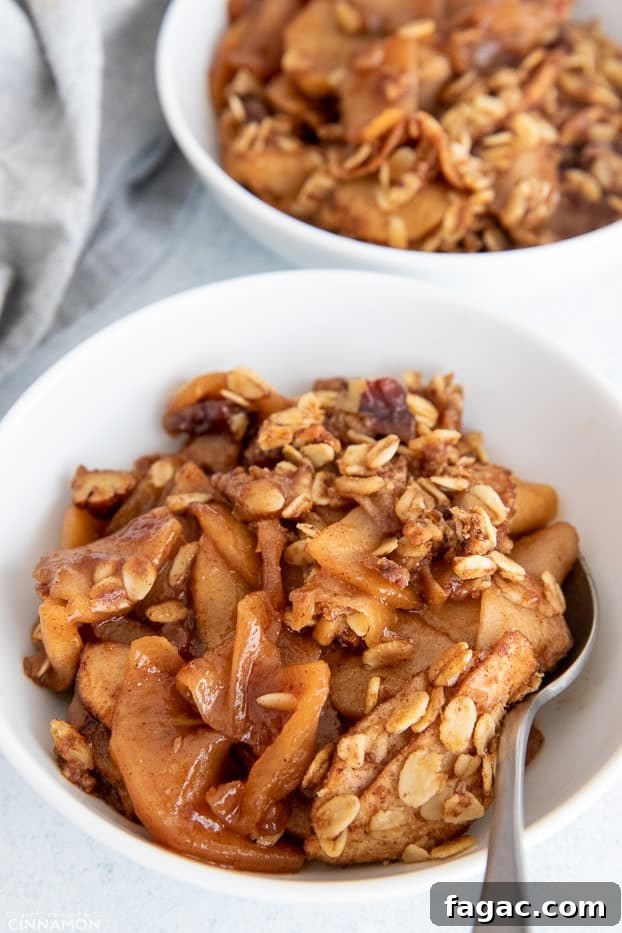 healthy apple crisp a bowl with easy healthy apple crisp with a spoon on the side