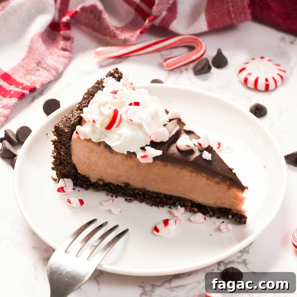 A slice of Healthier Gluten-Free Peppermint Cheesecake on a plate.