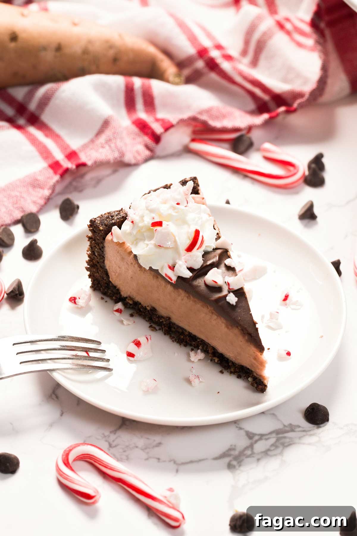 A slice of Healthier Gluten-Free Peppermint Cheesecake on a plate.