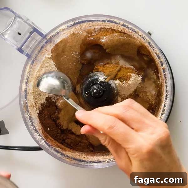 Mixing the peppermint cheesecake crust in a food processor.