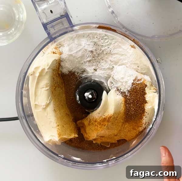 Cheesecake ingredients in a food processor.