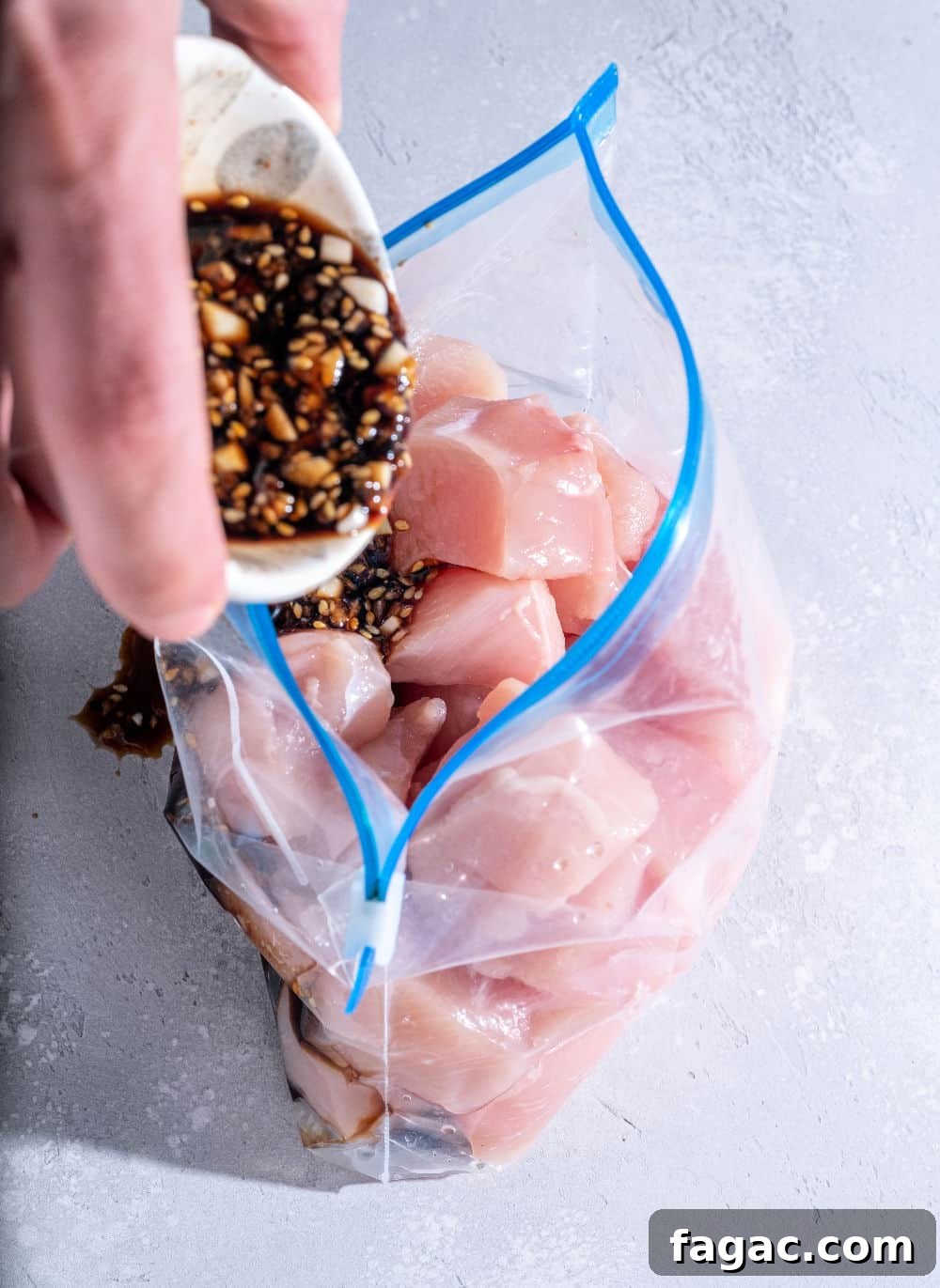 Meal Prep Guide: Plan and Freeze Make-Ahead Meals for Busy Weeks 3 prepping a freezer meal with sauce and raw chicken