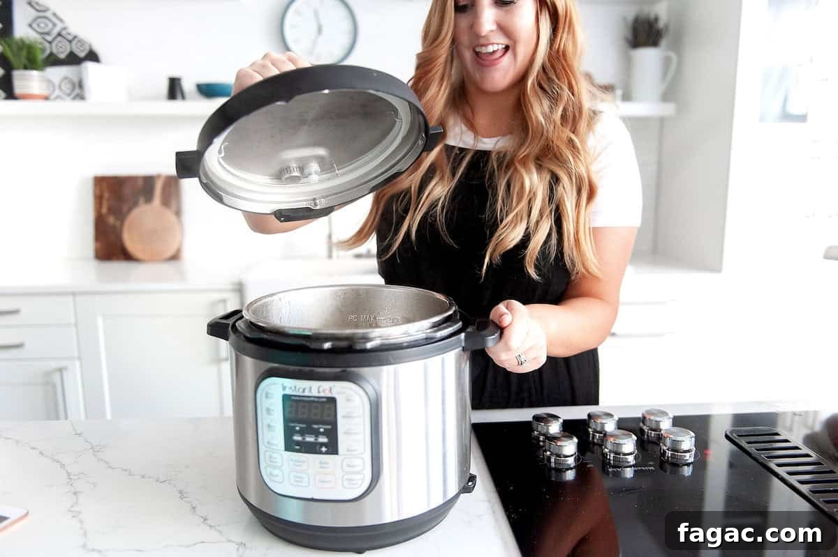 Meal Prep Guide: Plan and Freeze Make-Ahead Meals for Busy Weeks 5 steph checking her freezer meal in the instant pot