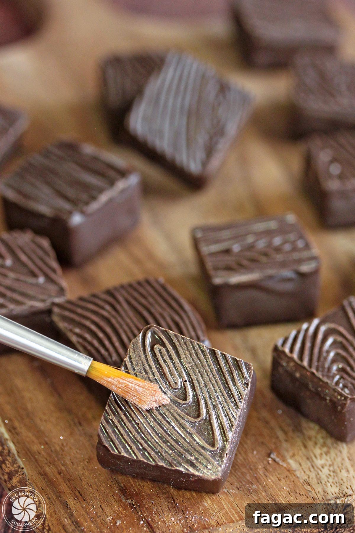 Rosemary Raspberry Truffles - painting gold luster dust on a chocolate truffle