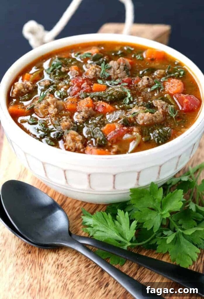 Low-Carb Sausage and Vegetable Soup Recipe for Weight Loss 3 sausage soup with vegetables in white bowl with spoon