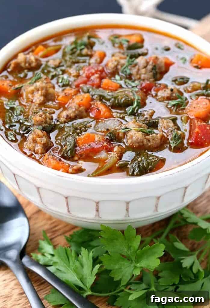 Low-Carb Sausage and Vegetable Soup Recipe for Weight Loss 7 Low Carb Sausage Vegetable Soup on a board with parsley