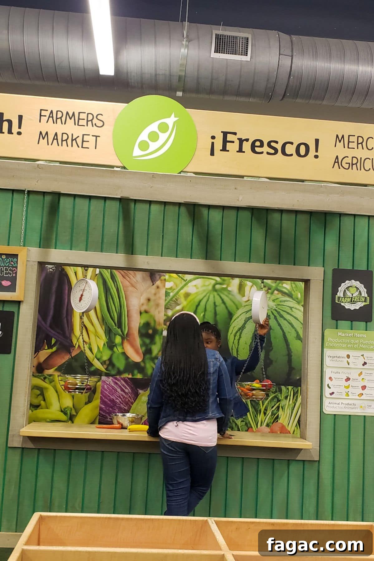 Family Weekend Guide: Top Things to Do in Austin, Texas 3 Kids playing at Farmer's Market at Austin Children's Museum.