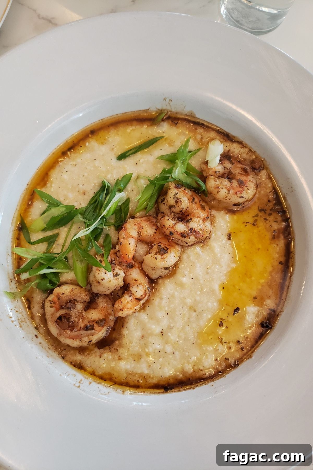 Family Weekend Guide: Top Things to Do in Austin, Texas 4 A plate of shrimp and grits at a restaurant in Austin, Texas.