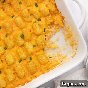 Buffalo Chicken Tater Tot Casserole Recipe with Cheesy Buffalo Sauce 11 Buffalo Chicken Tater Tot Casserole in a white baking dish.