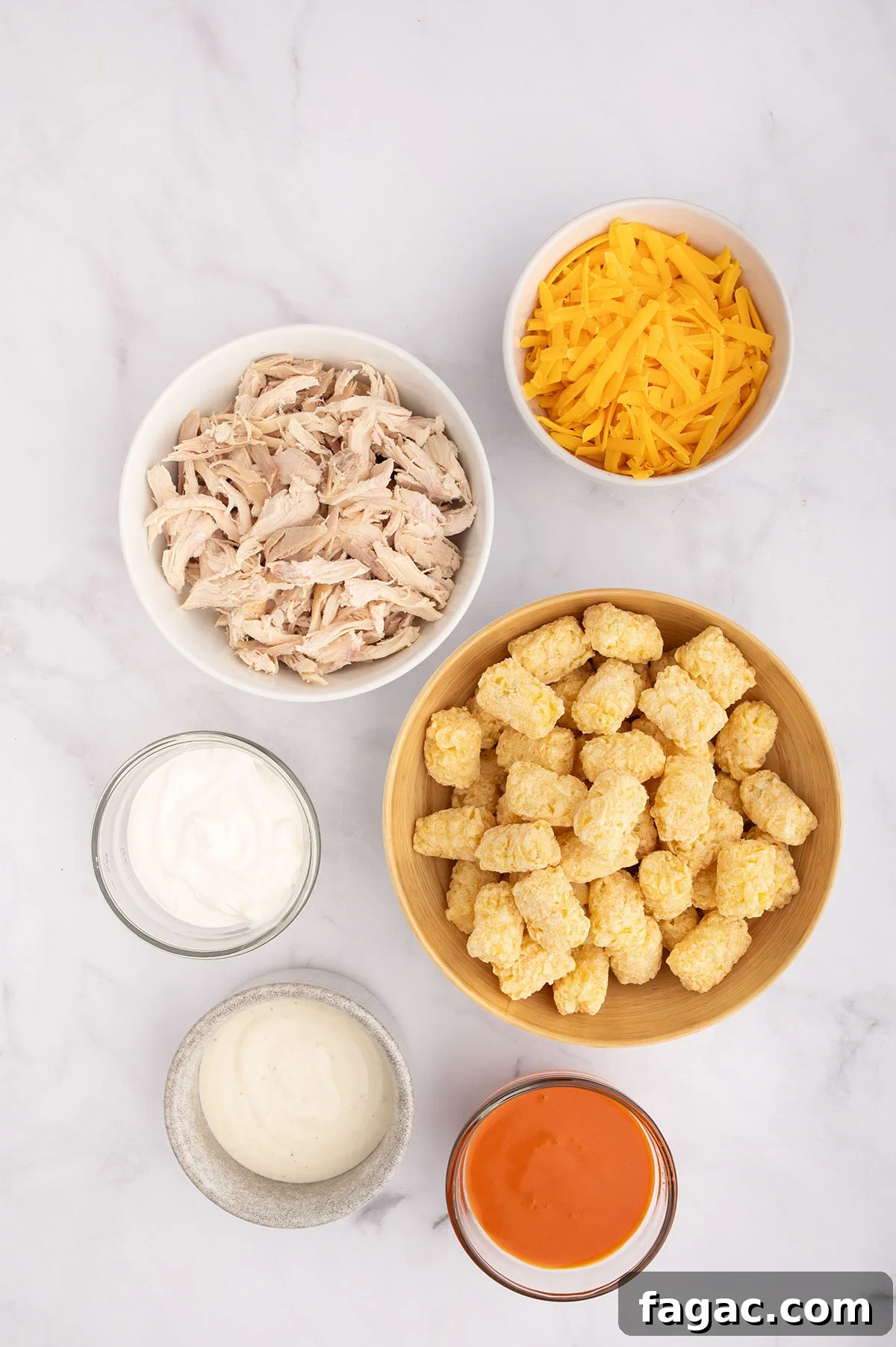 Buffalo Chicken Tater Tot Casserole Recipe with Cheesy Buffalo Sauce 3 Ingredients to make Buffalo Chicken Tater Tot Casserole set out on the counter.