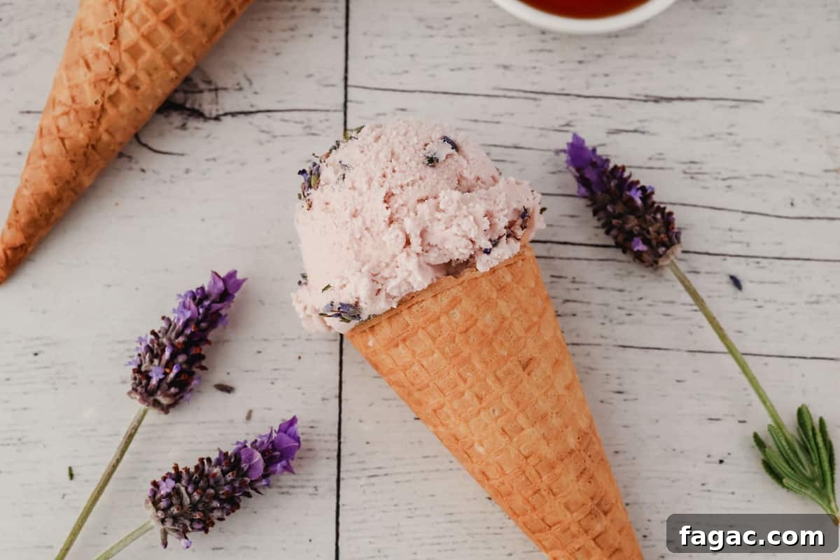 Homemade Lavender Ice Cream Recipe with Creamy Floral Flavor 7 Scoop of lavender and honey ice cream with fresh lavender flowers.