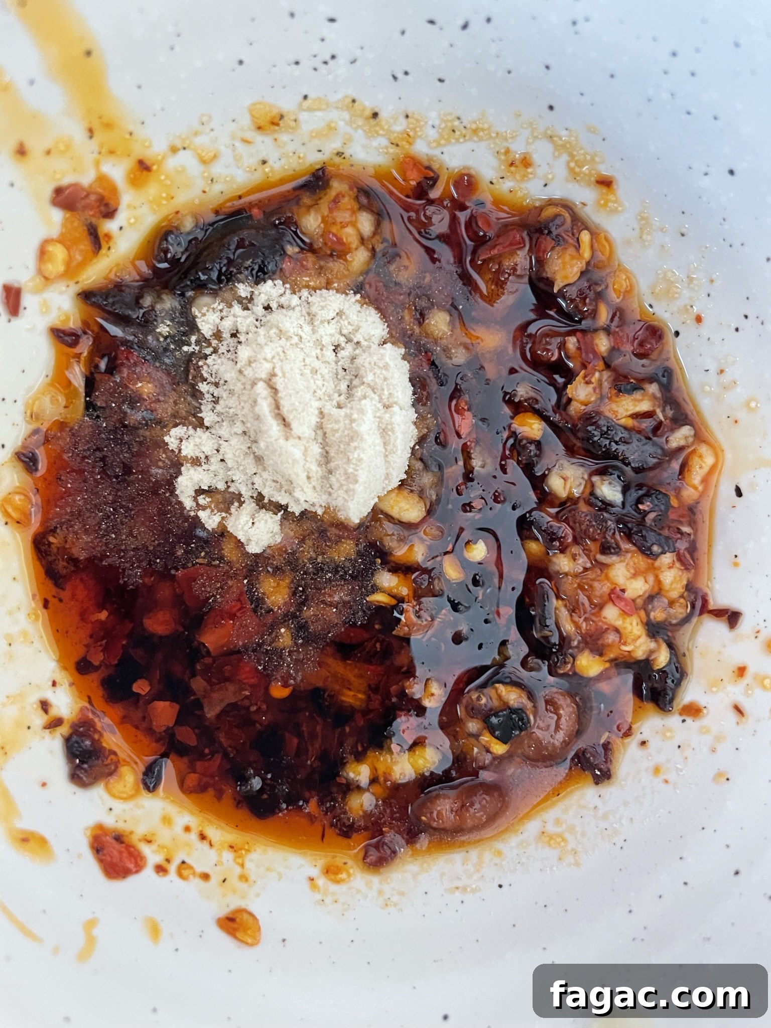 Combine ingredients for garlic chili oil Combine ingredients for garlic chili oil