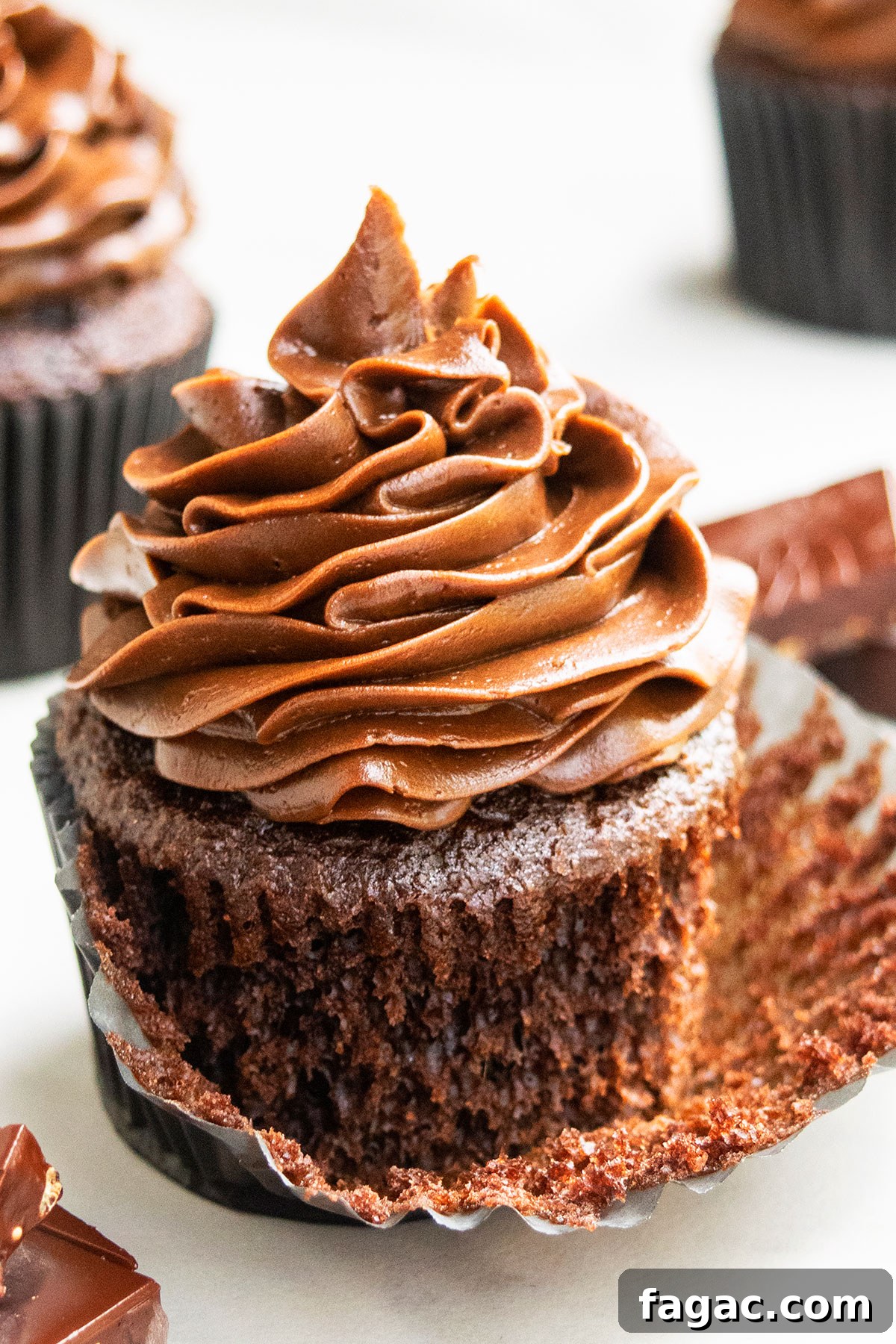 Soft, Moist Chocolate Cupcakes That Melt in Your Mouth 2 Best Easy Chocolate Cupcakes with Chocolate Buttercream Frosting- Liner Partially Peeled.