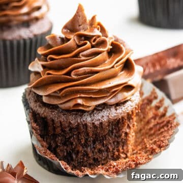 Best Easy Soft and Moist Chocolate Cupcakes With Chocolate Buttercream Frosting- Liner Partially Removed.