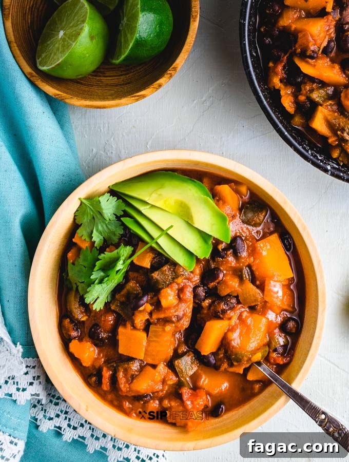 Overhead shot of the chili with limes on the side.