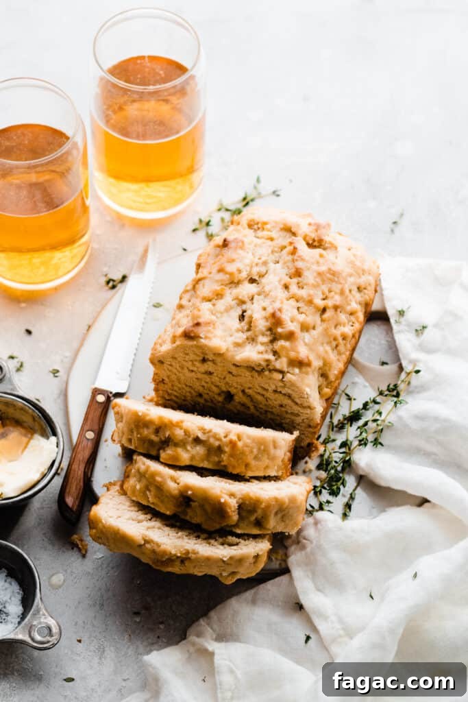 Classic Beer Bread with Salted Honey Butter Recipe 3 A partially sliced loaf of the beer bread